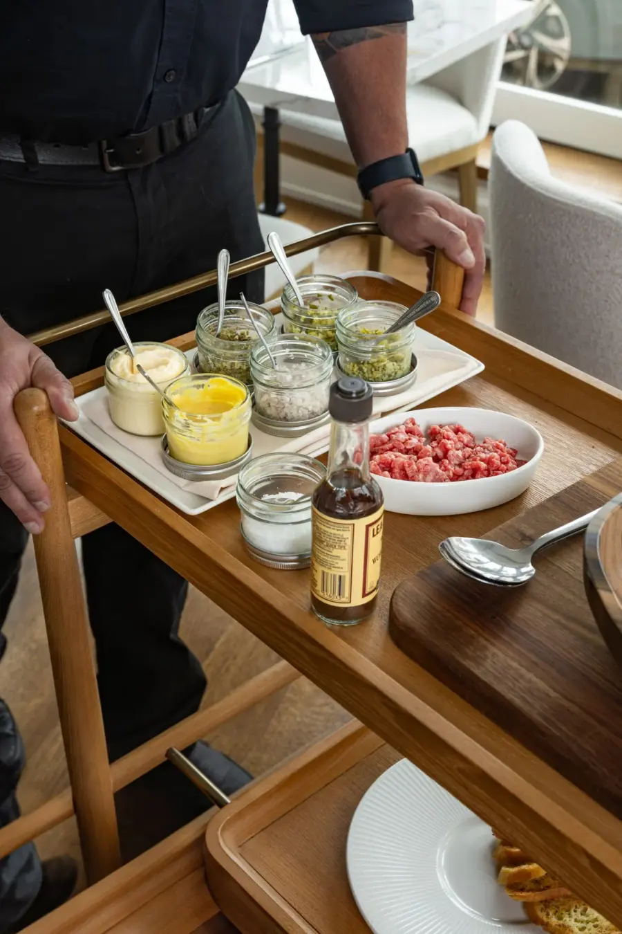 The cocktail cart being finished tableside at L’Étoile